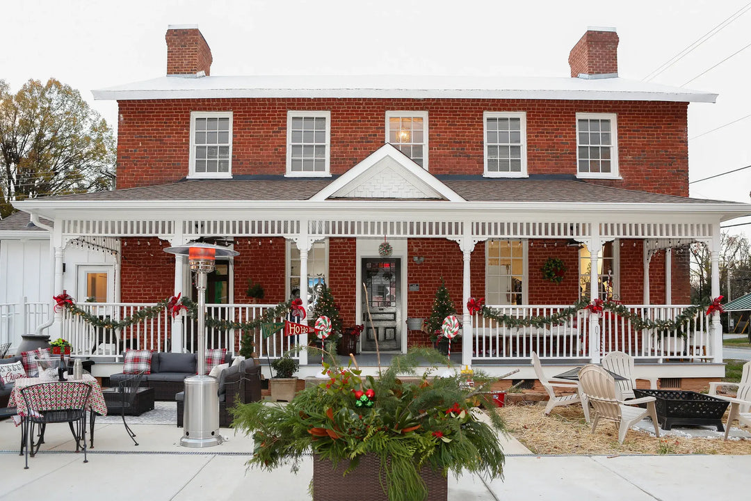 Martin's Mercantile exterior back view with outdoor seating area & holiday decorations